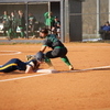 The Lady Panthers steal one on third in route to one of seven runs against Harlan. Photo by Larry Spicer